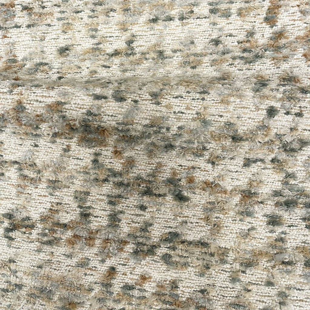 Textured stone surface with a mix of gray, brown, and black colors.